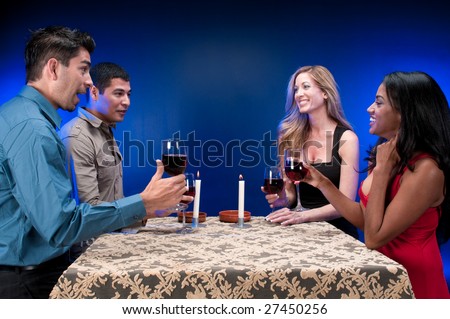 Group of friends drinking wine and celebrating.
