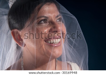 Latin woman in her 40 getting ready to be married, very happy.