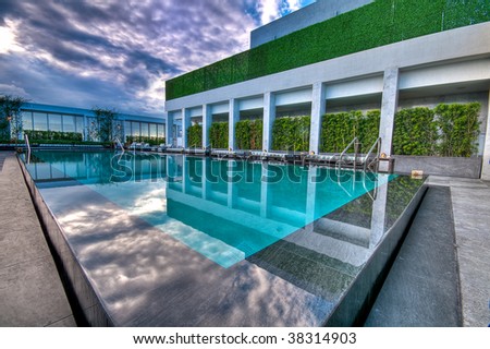 luxury swimming pool at luxury hotel stock photo 38314903 luxury swimming pools 450x319 stock photo luxury swimming pool at luxury hotel 38314903 Luxury Swimming Pools