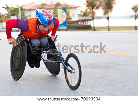 MIAMI, FL - JANUARY 30: An unidentified competitor racing in a wheelchair during the Miami Marathon on January 30, 2011 in Miami, Florida.