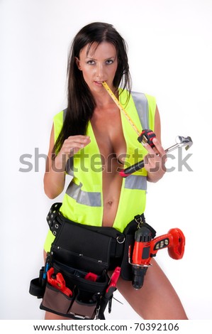 Very sensual woman with safety vest and tool. All logos removed.