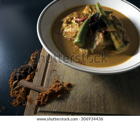 A food presentation of Fish Curry,a common local food that can be found in an Indian populated country.