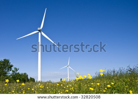 Wind turbines in a field. Demonstrating the power of green, natural, renewable energy.