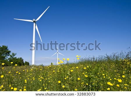 Wind turbines in a field. Demonstrating the power of green, natural, renewable energy.