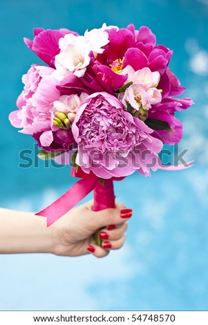 stock photo A nice wedding bouquet of purple pink and white peonies held 