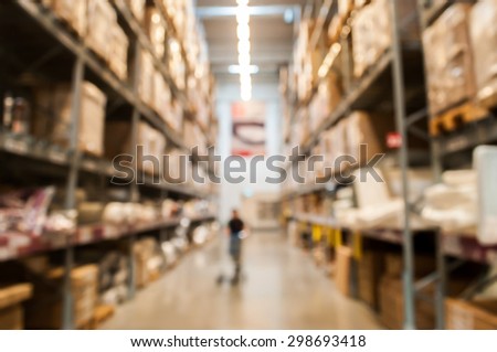 Blurred Background Image of Warehouse or Storehouse with some people