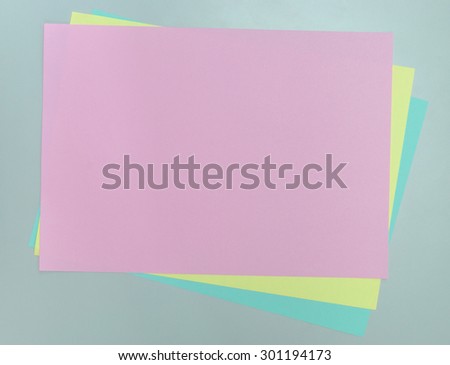 Blank Colored Paper on white table background