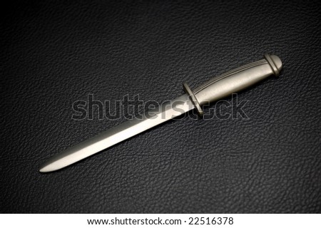 Silver Dagger on Black Leather