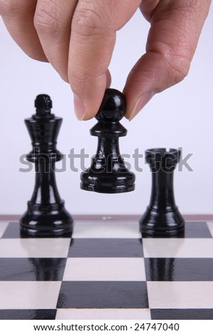 Chess player making his move.