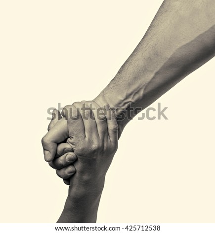 helping hand outstretched for salvation  on isolated toned background