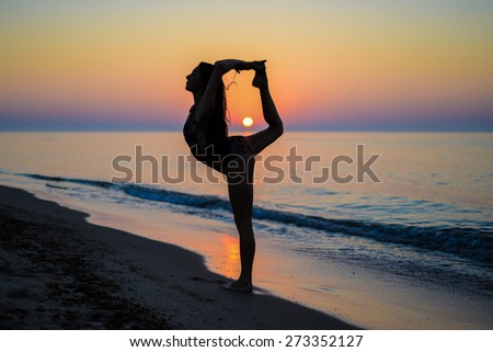 silhouette of beautiful girl on the beach