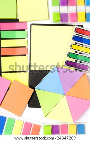 Set off colored stickers and notepaper on white