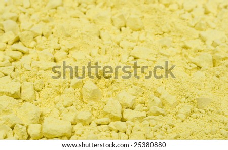 Colored grainy crushed chalk\'s textured background. Yellow.