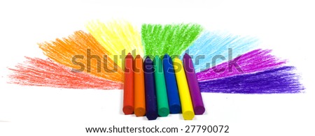Seven wax crayons on a background the drawn semicircle from missing beams of colors of a rainbow