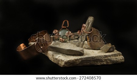 Beautiful composition of jewelry and rocks by Charismatique