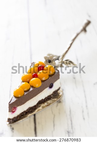 raw vegan cake on a silver spoon