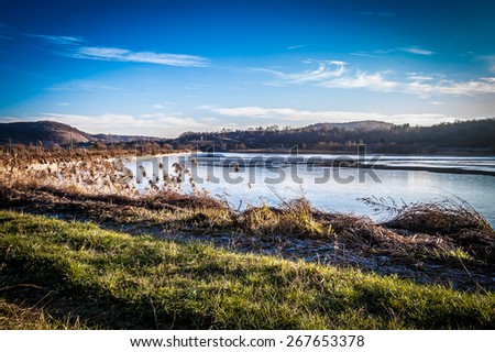 Sunny winter day on a lake, with nobody, landscape, with sun lights