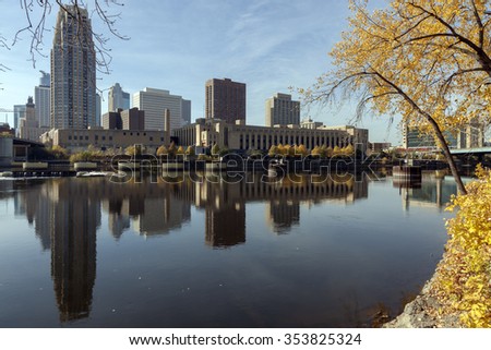 Minneapolis Minnesota skyline. Minneapolis skyline with reflections in the Mississippi River during the fall.