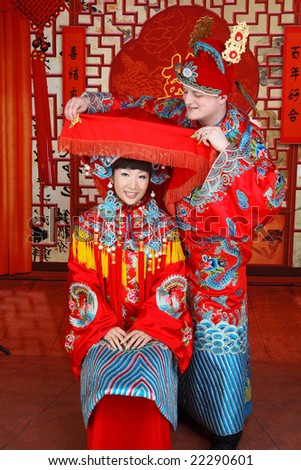 stock photo Couple dressed in traditional Chinese wedding dress