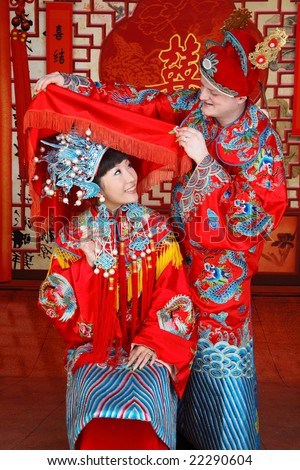 stock photo Couple dressed in traditional Chinese wedding ress