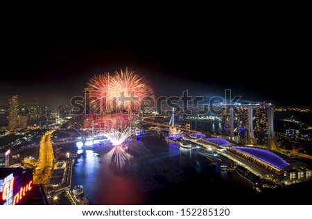 SINGAPORE - DEC 31: firework display above Marian Bay on December 31, 2012 in Singapore. Image includes Marina Bay Sands Casino and Hotel on the right