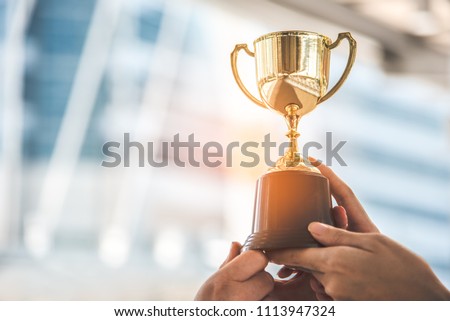 Champion golden trophy for winner background. Success and achievement concept. Sport and cup award theme.