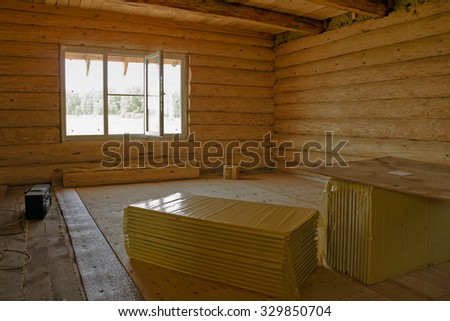 Is unfinished wood log cabin home.The interior.