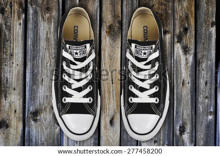 CHLUMCANY, CZECH REPUBLIC, MARCH 27, 2015: Black low Converse shoes on wooden planks