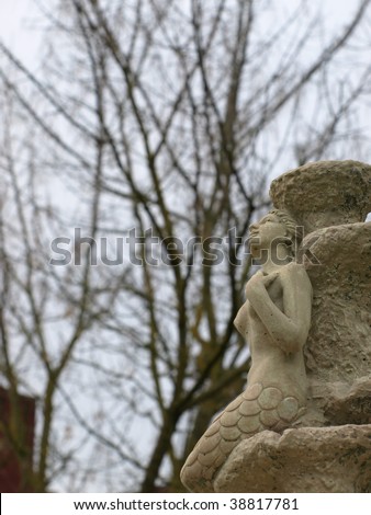 Statue of a sad siren