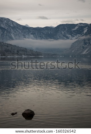 landscape of the lake bohinj in winter with bad weather, slovenia