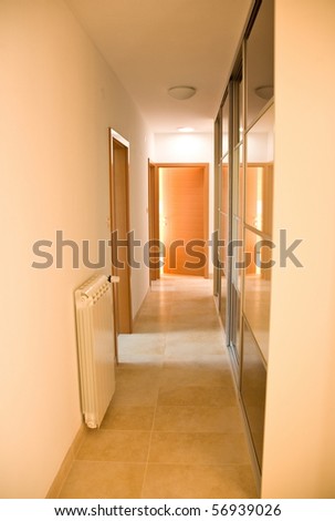 indoor house corridor with closet and radiator and doors