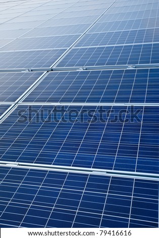blue colored, photovoltaic solar modules for producing electricity, green energy concept texture