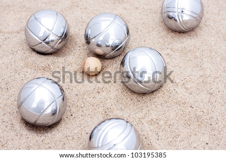 Game of jeu de boule, silver metal balls in sand. A french ball game