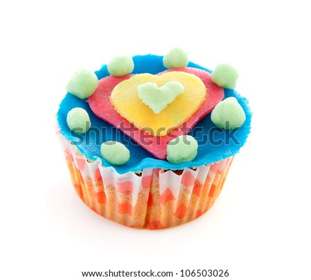 cupcake with marzipan heart decoration over white background