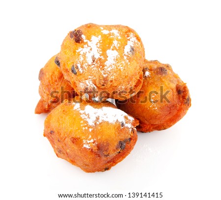 pile of Dutch donut also known as oliebollen, traditional New Year\'s eve food isolated on white background