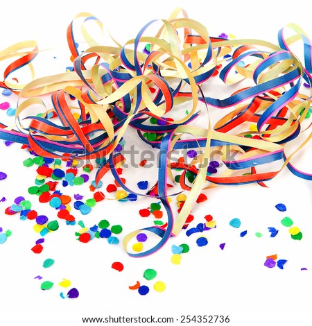 colorful confetti and party streamers over white background