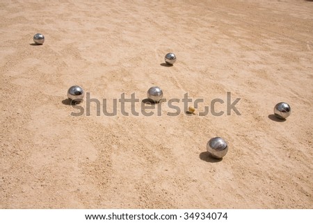 Game of jeu de boule, silver metal  balls in sand. A french ball game