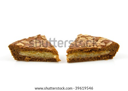Slices of typical Dutch filled pie with almond for Sinterklaas, over white background