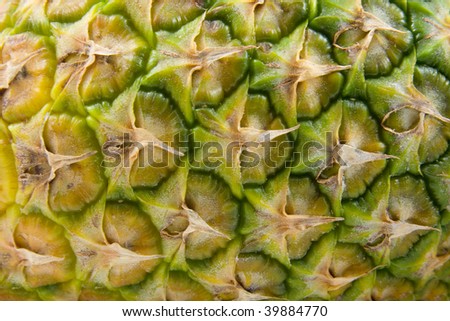 The peel of a pineapple in closeup can be used as background