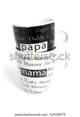 stacked Coffee mugs with text Mom and  Dad over white background