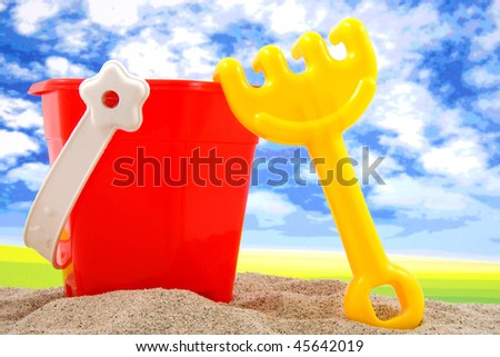 plastic play toys for at the beach over white background