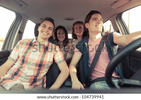 Four Friends in a Car Leaving For Vacation