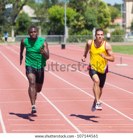 Two Track and Field Athletes Running