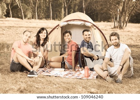 Group of People Camping and Singing