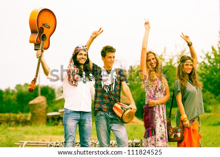 Hippie Group Dancing in the Countryside