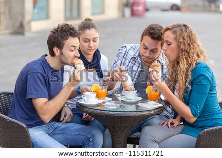 Group of Friends Having a Traditional Italian Breakfast