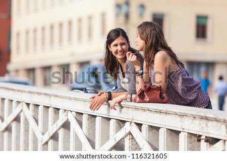 Two Women Talking in the City