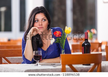 Bored Woman Alone at Restaurant
