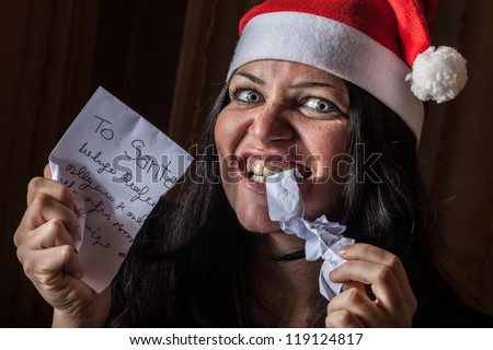 Bad Woman with Santa Hat destroying a Letter