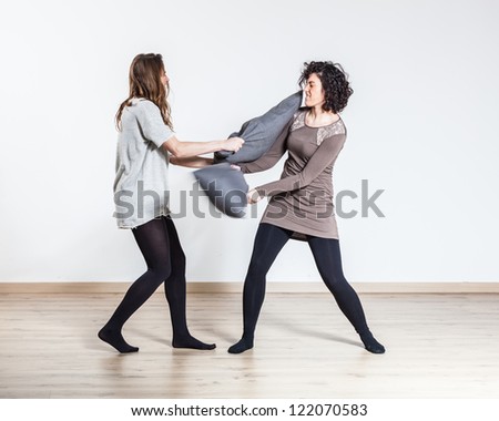 Pillow Fight between Two Beautiful Women
